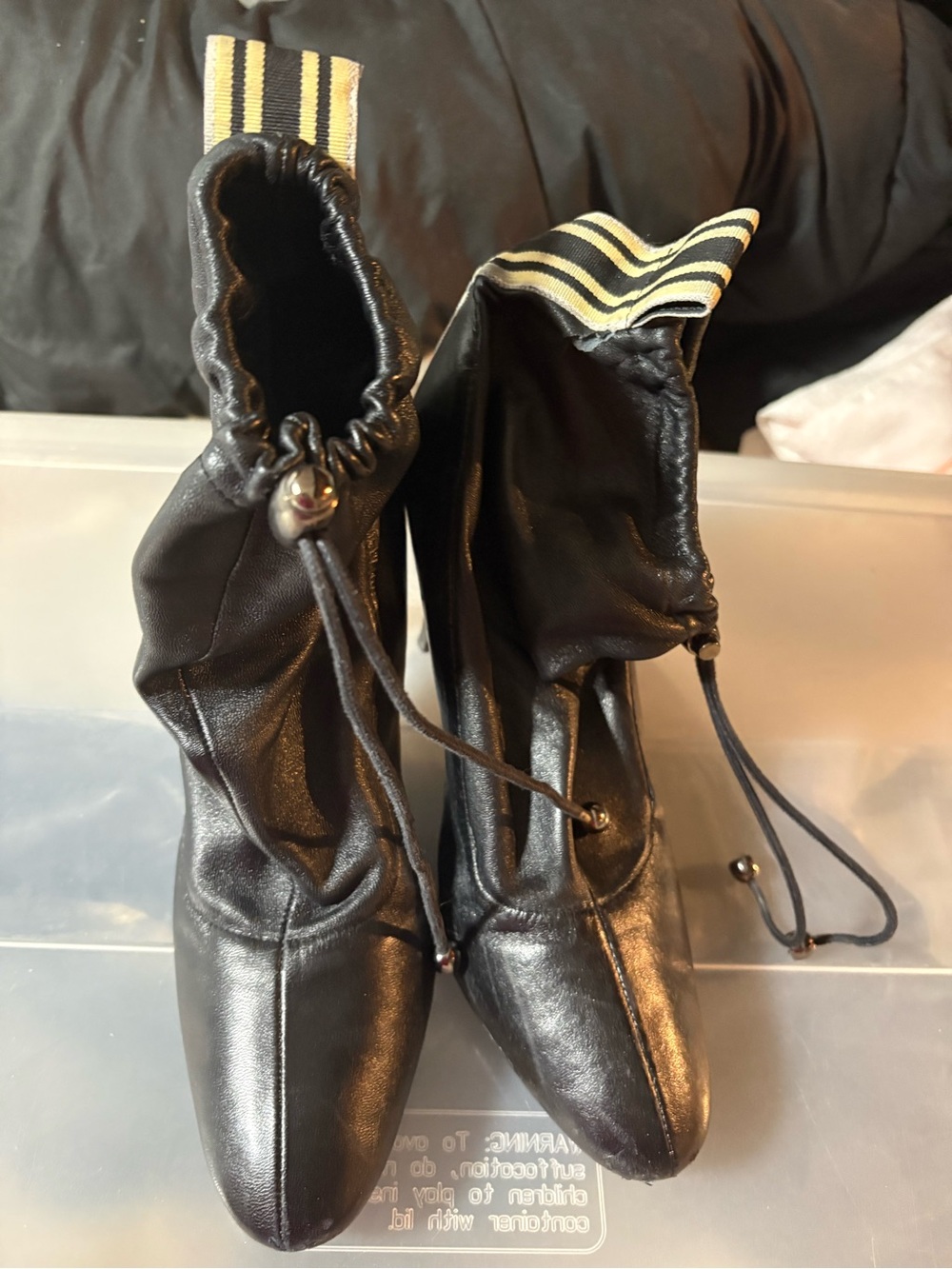 Seven7 Black Leather Drawstring Ankle Booties with Yellow-Striped Pull Tabs